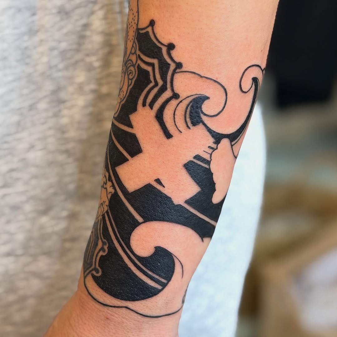 Bold blackwork ornamental swirl with dramatic negative space