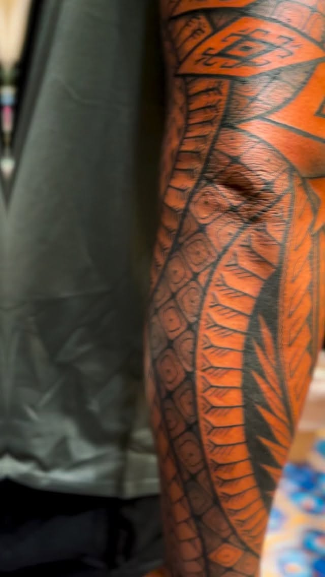 Bold Polynesian-inspired snake motif with geometric scales
