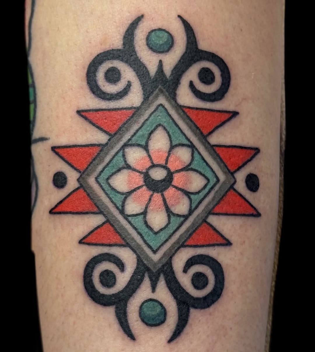 Bold geometric diamond mandala with floral center and sunbursts