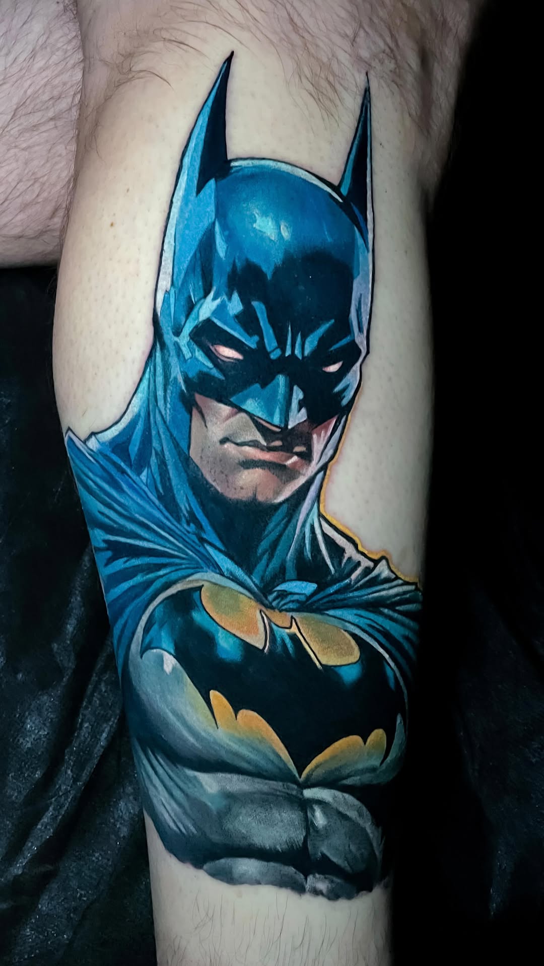 Vibrant blue Batman portrait with bold shading.