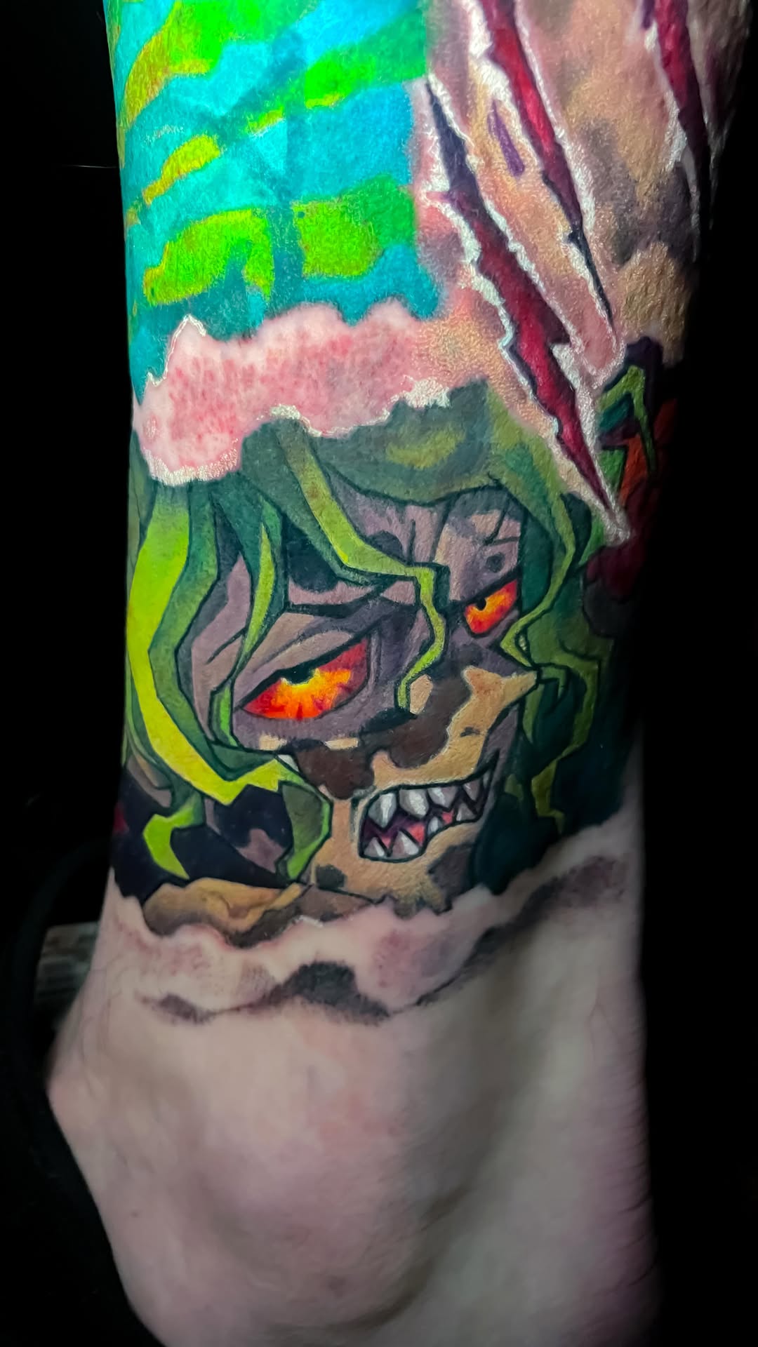 Neon-green demon skull with fiery orange eyes, bold outlines