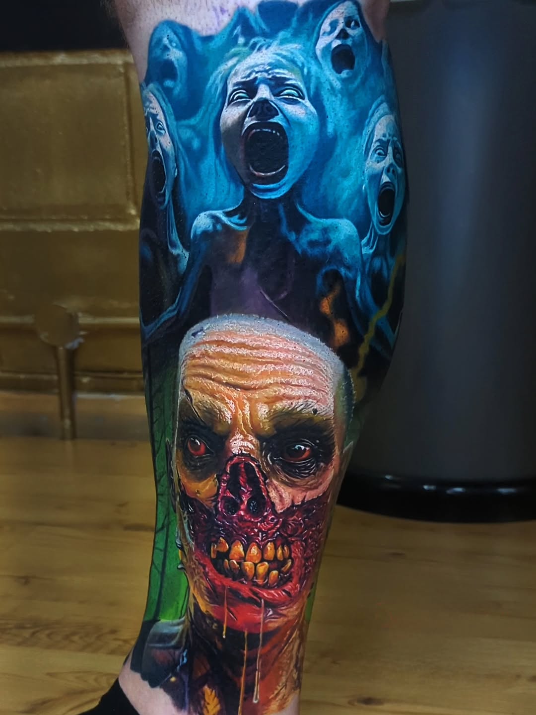 Vivid horror leg sleeve with screaming blue phantoms and gory skull