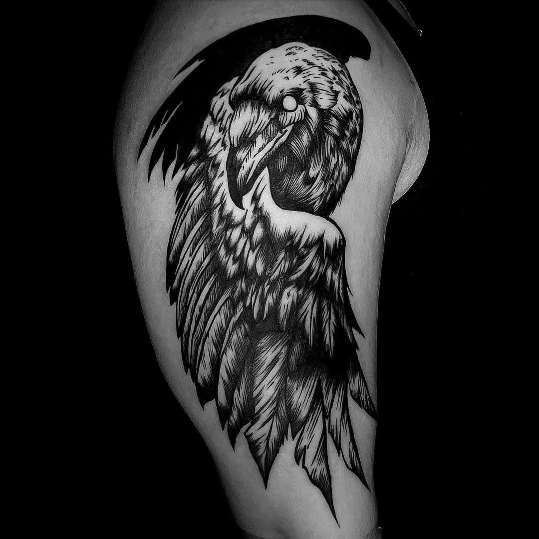 Engraved blackwork crow with meticulous feather detailing