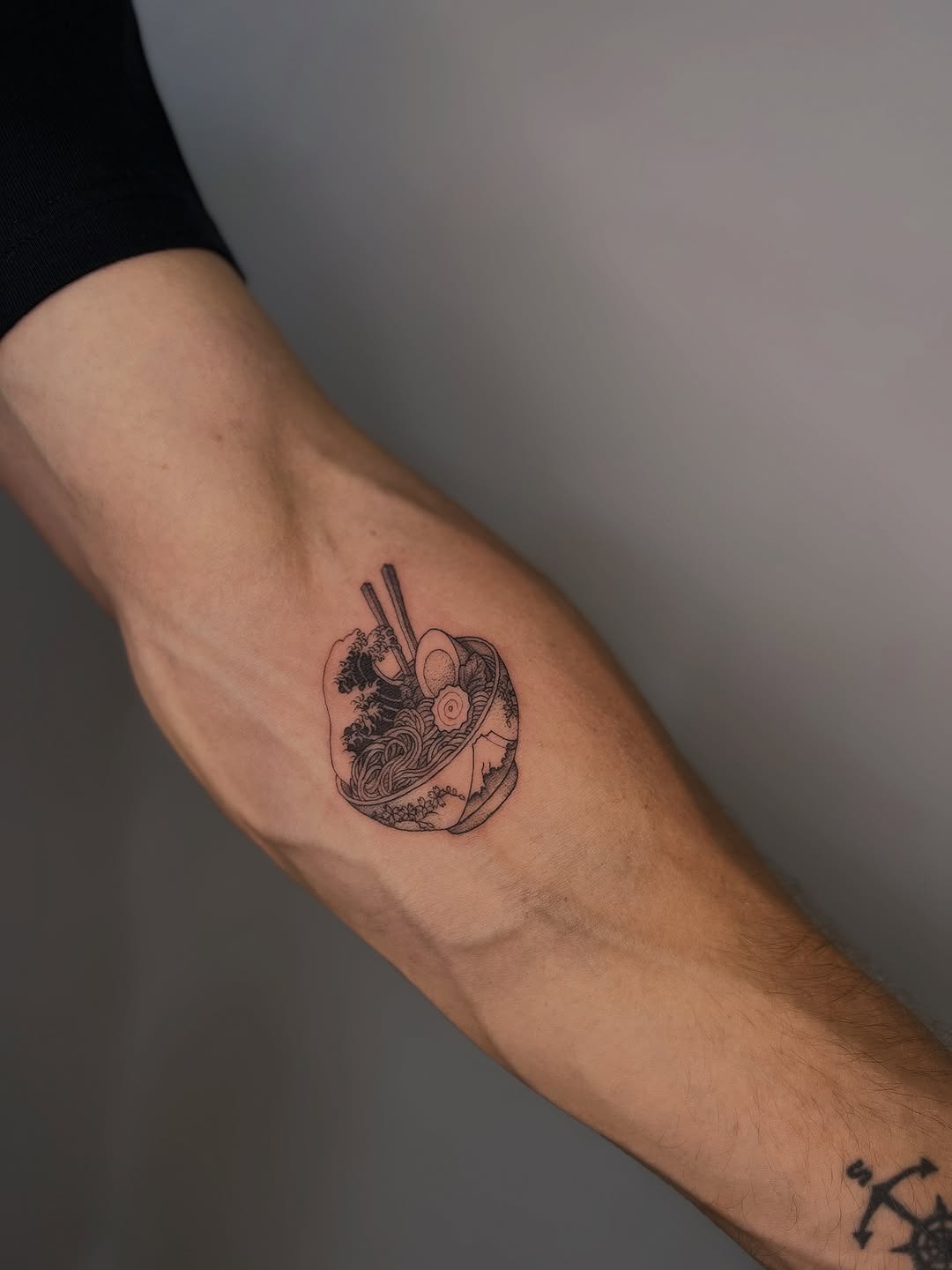 Whimsical ramen-bowl tattoo in fine-line ink with chopsticks