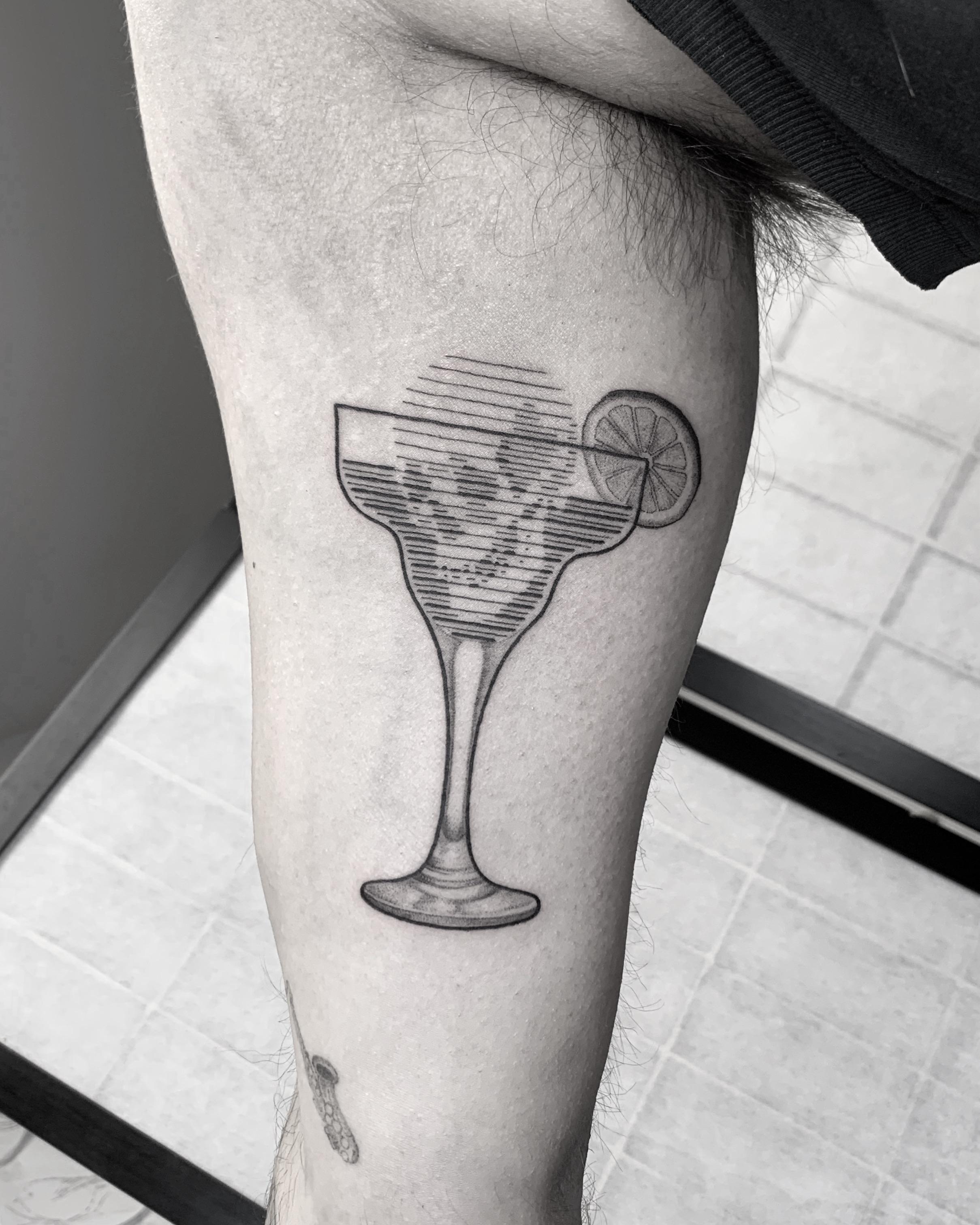 Geometric-stripe margarita glass with lemon wheel