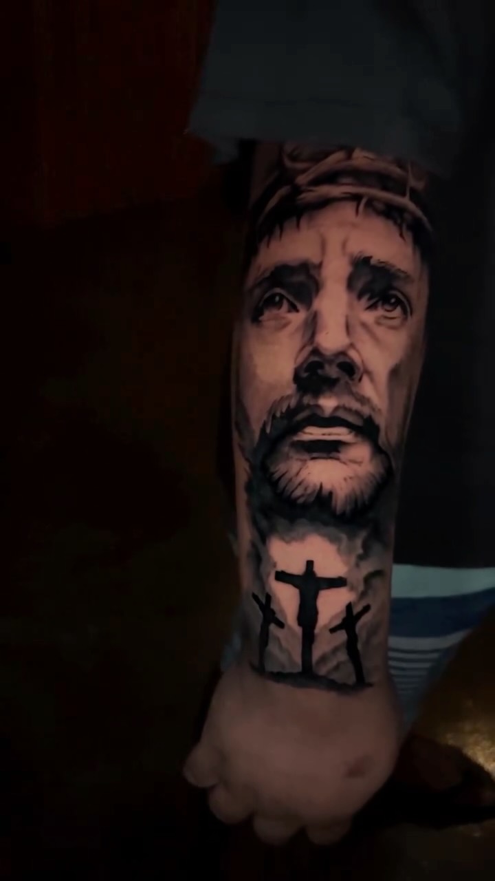 Photorealistic Jesus portrait with Calvary crosses on forearm