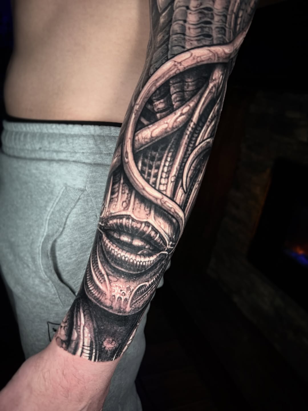 Giger-inspired biomechanical sleeve with sinewy tubes and gears