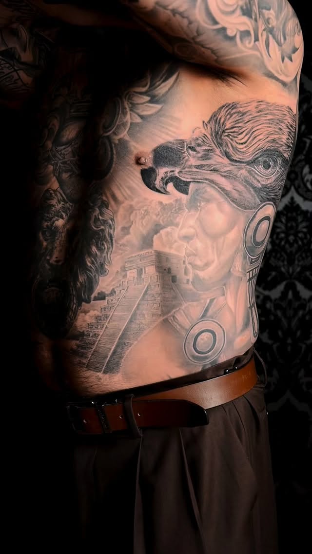 Bold grayscale Aztec eagle and temple across chest