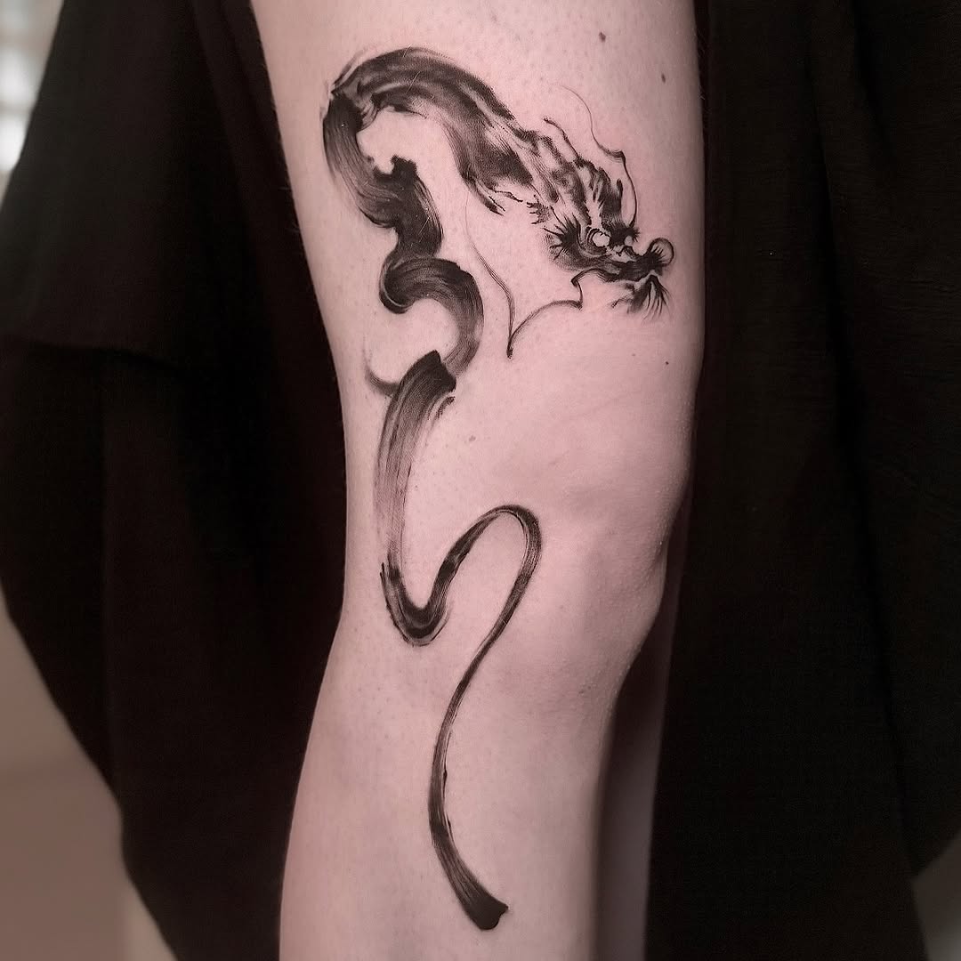 Fluid brushstroke dragon in black sumi-e style