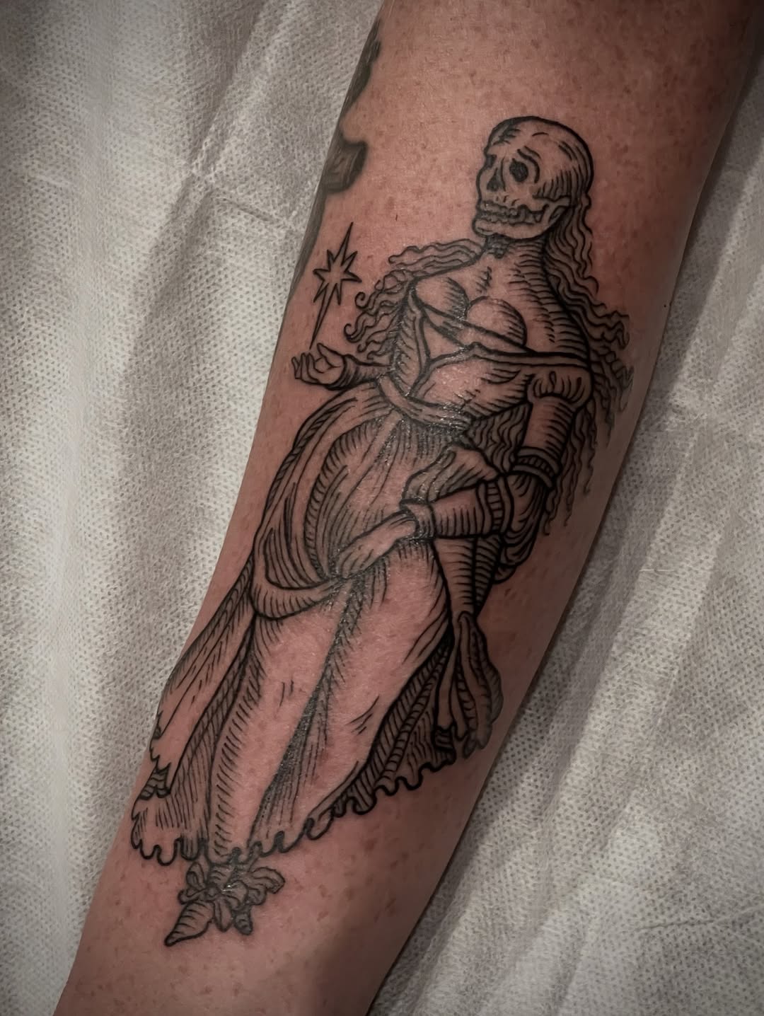 Medieval woodcut-inspired skeletal maiden in flowing gown
