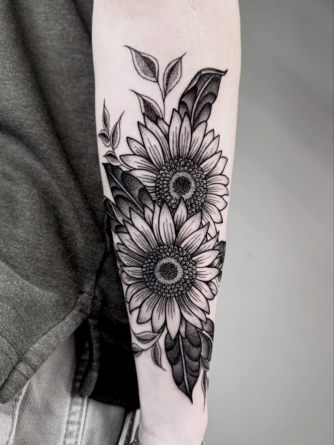 Bold black-and-gray sunflowers with delicate stippling.