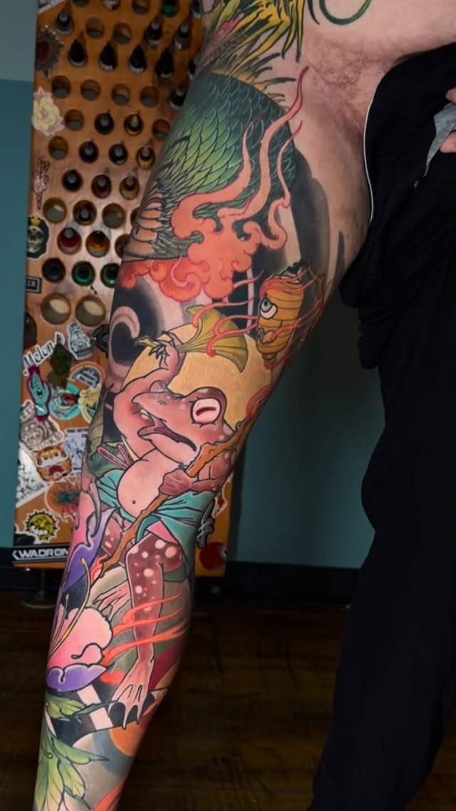 Vibrant full-leg cartoon scene sleeve with playful creatures