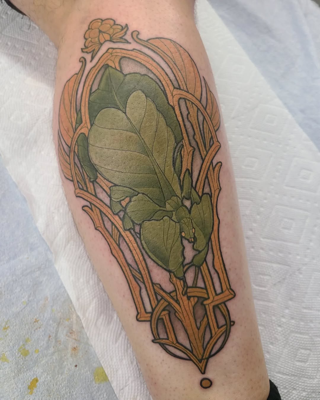 Art Nouveau frame encasing a verdant leafy motif.