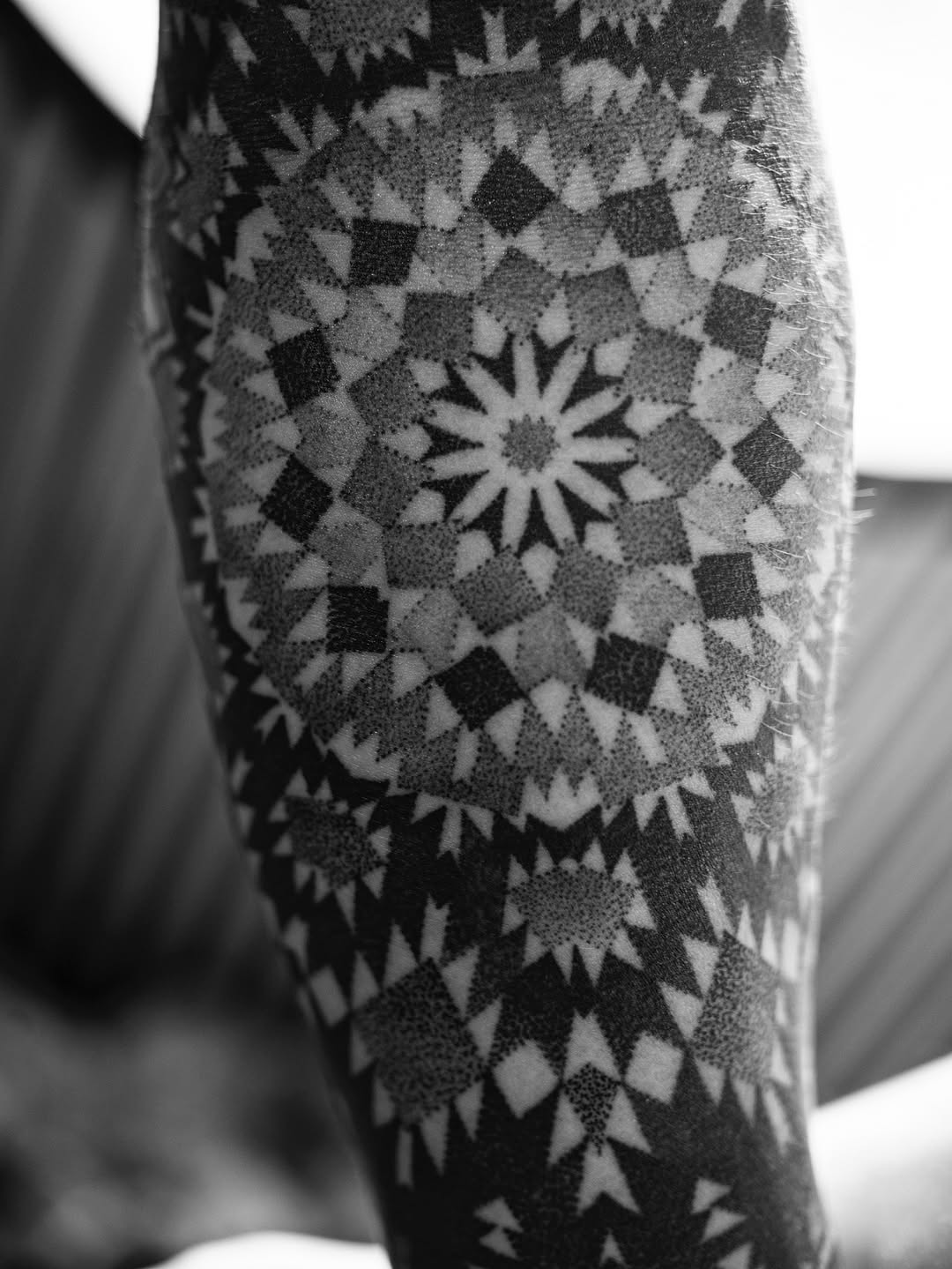 Intricate blackwork mandala sleeve with dot shading