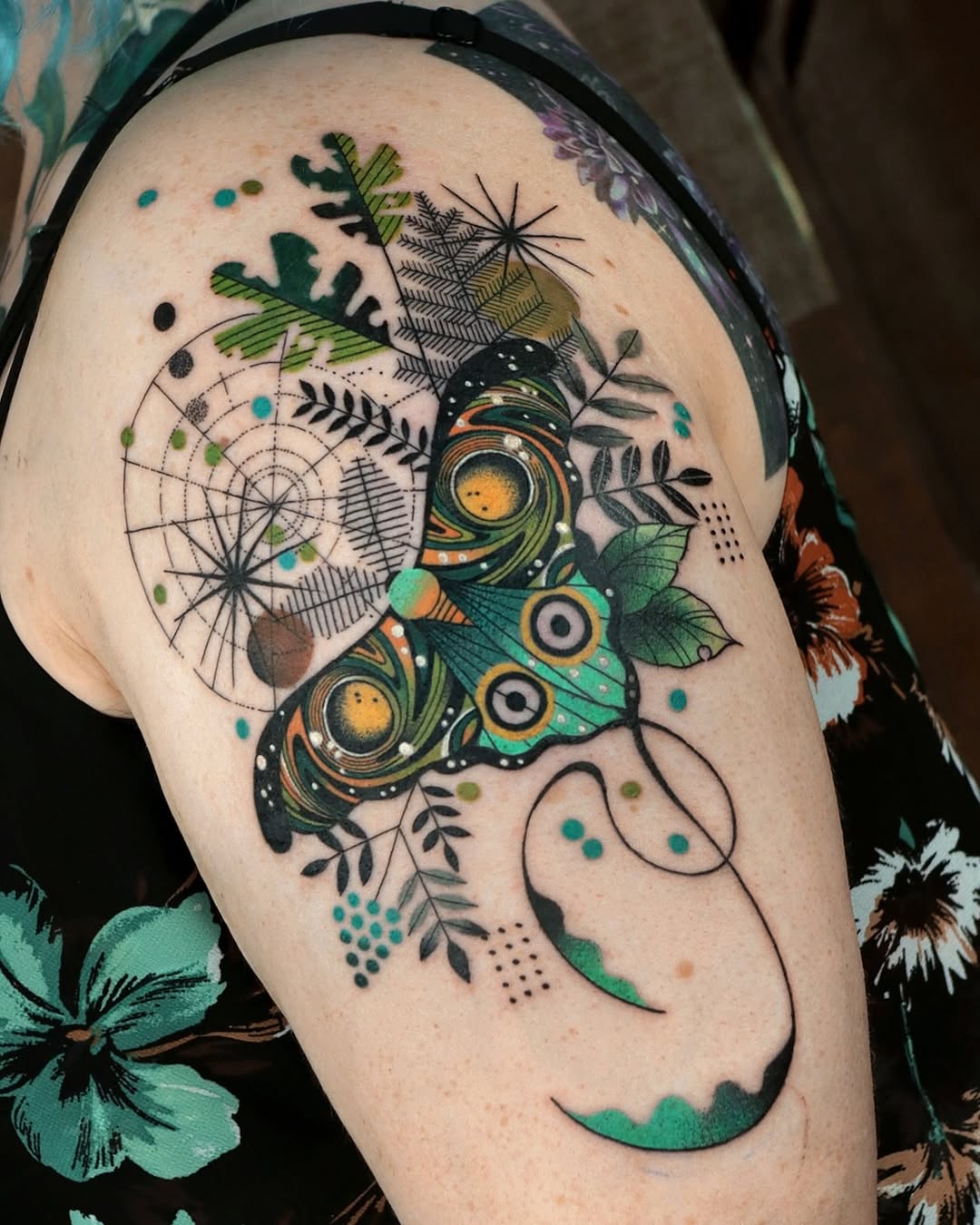 Vibrant geometric moth amid swirling linework and leaves