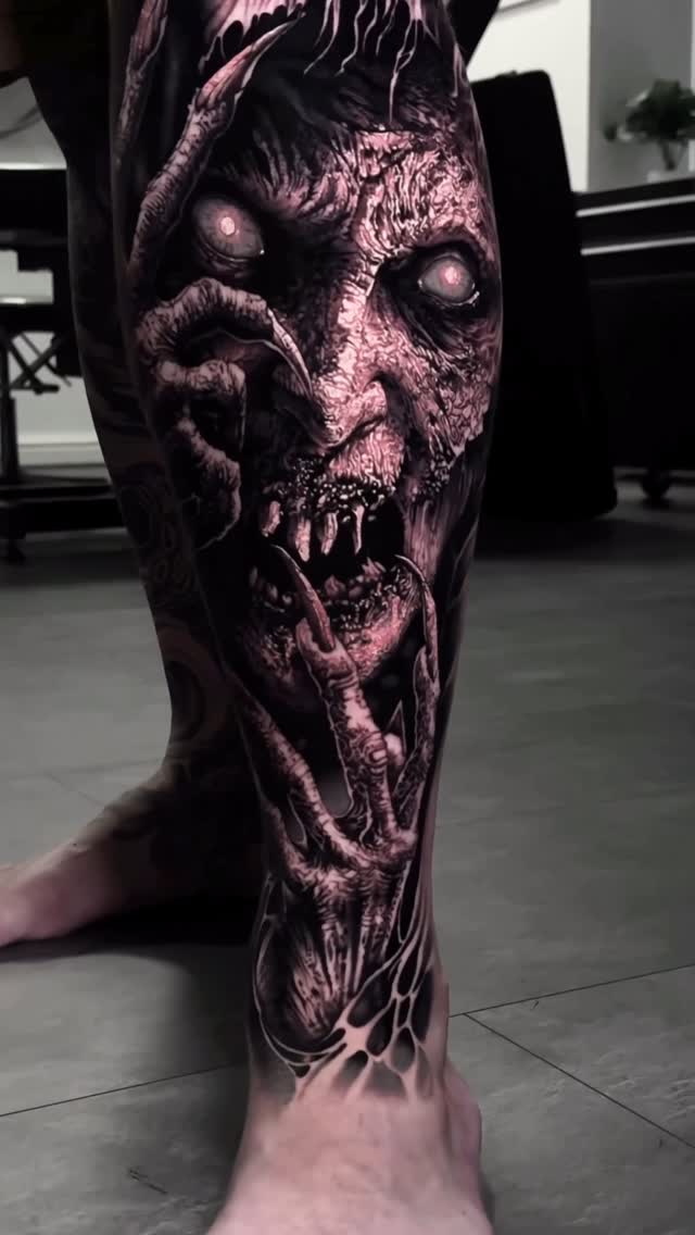 Hyper-detailed zombie-face leg sleeve in high-contrast grayscale.