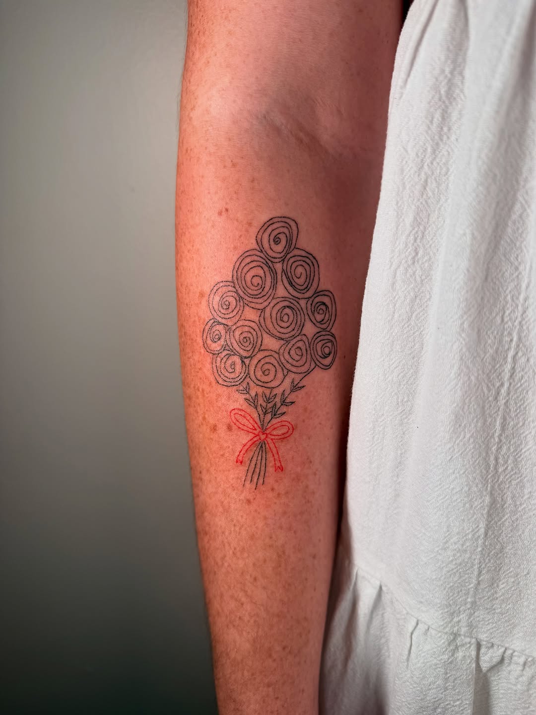 Handpoke floral memorial tattoo