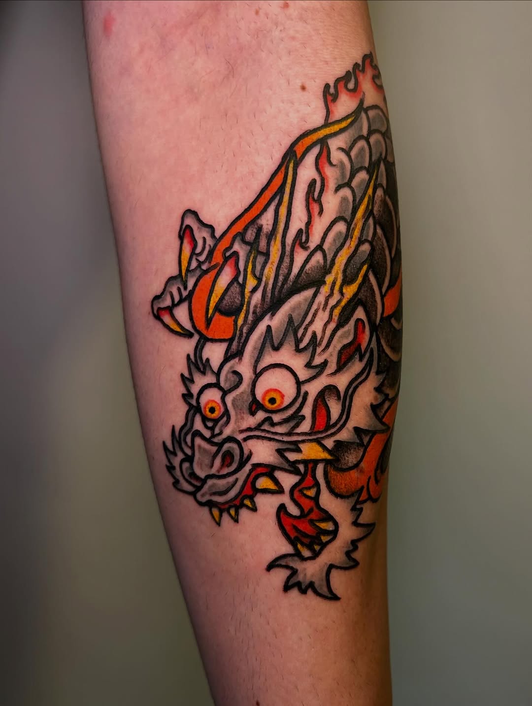 Energetic neo-traditional dragon head with bold outlines.