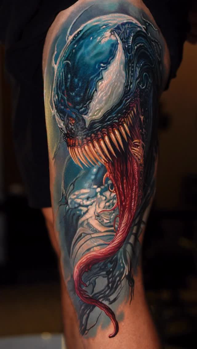 Hyper-detailed venomous symbiote engulfing forearm, electric blue and crimson
