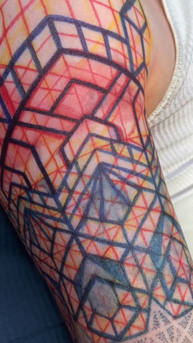 Bold geometric maze of blue lines, red grid shading