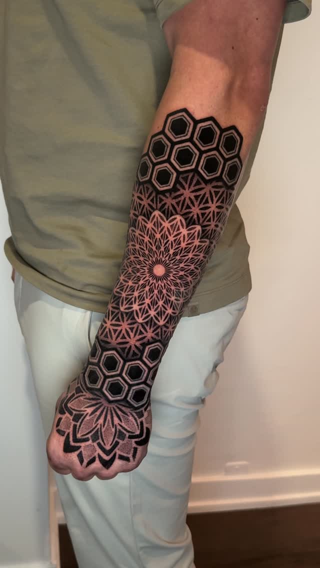 Intricate geometric forearm sleeve with interlocking mandalas