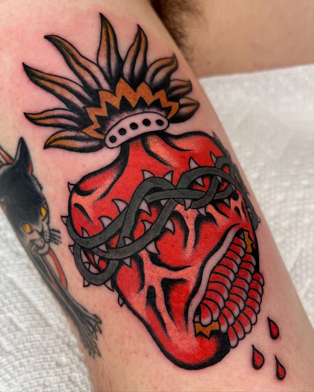 Bold traditional sacred heart wrapped in thorny vines