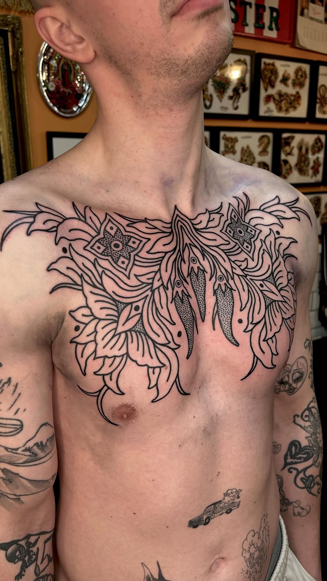 Bold ornamental floral chest piece with flowing linework