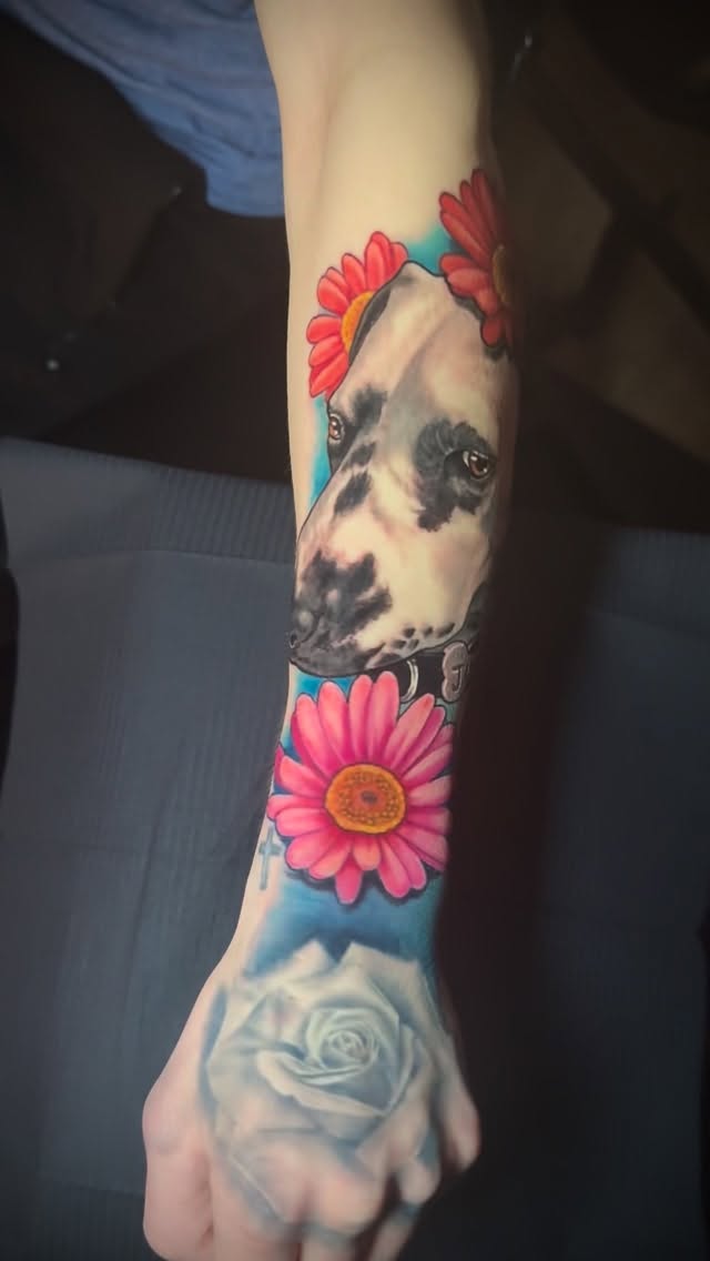 Lifelike dog portrait with vibrant florals and blue backdrop