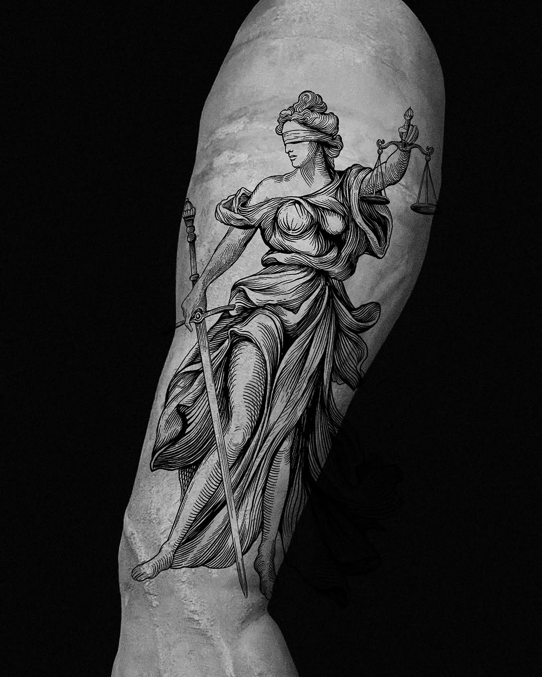Engraving-style Themis on forearm with scales and sword