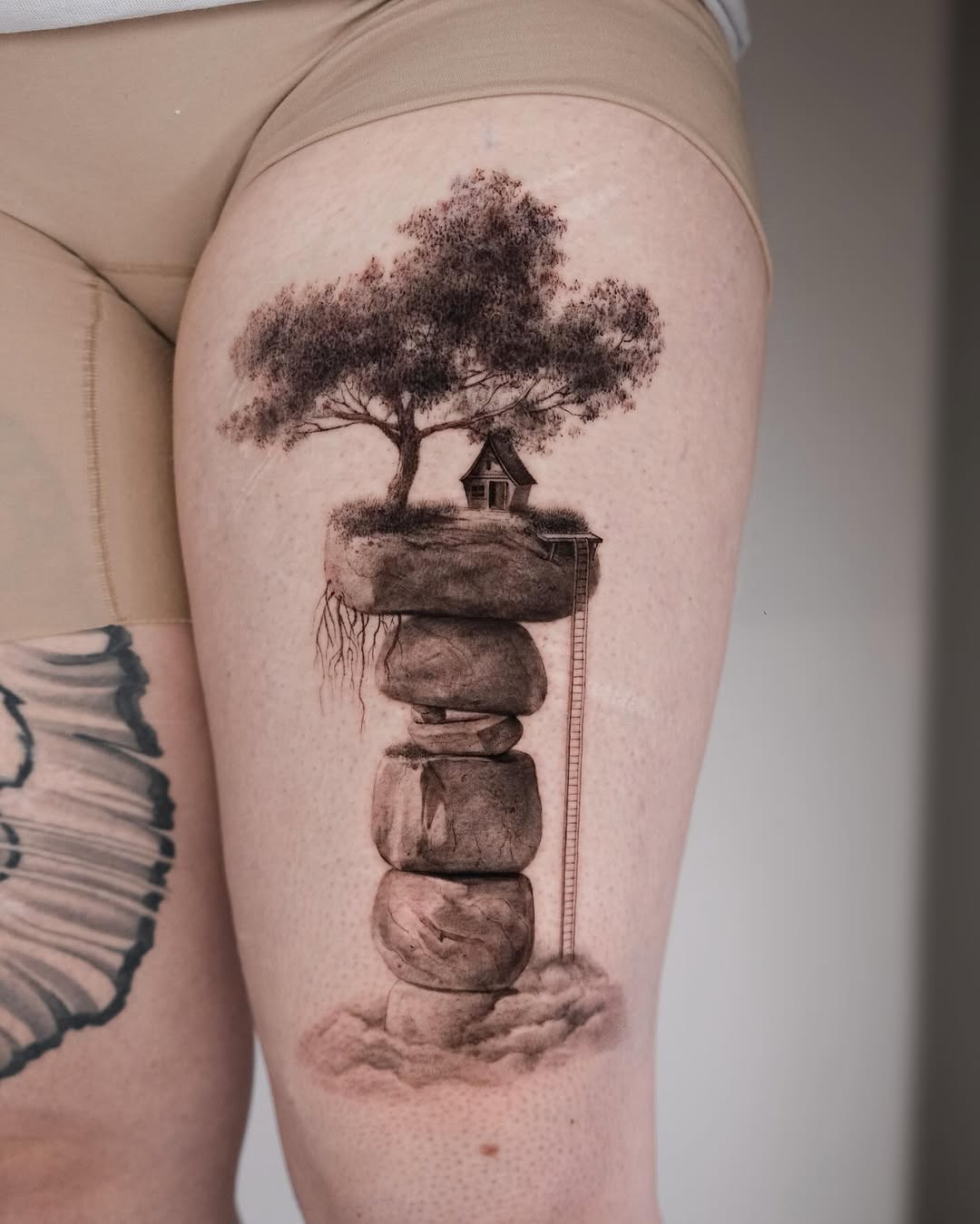 Dreamy treehouse perched on stacked rocks with ladder.