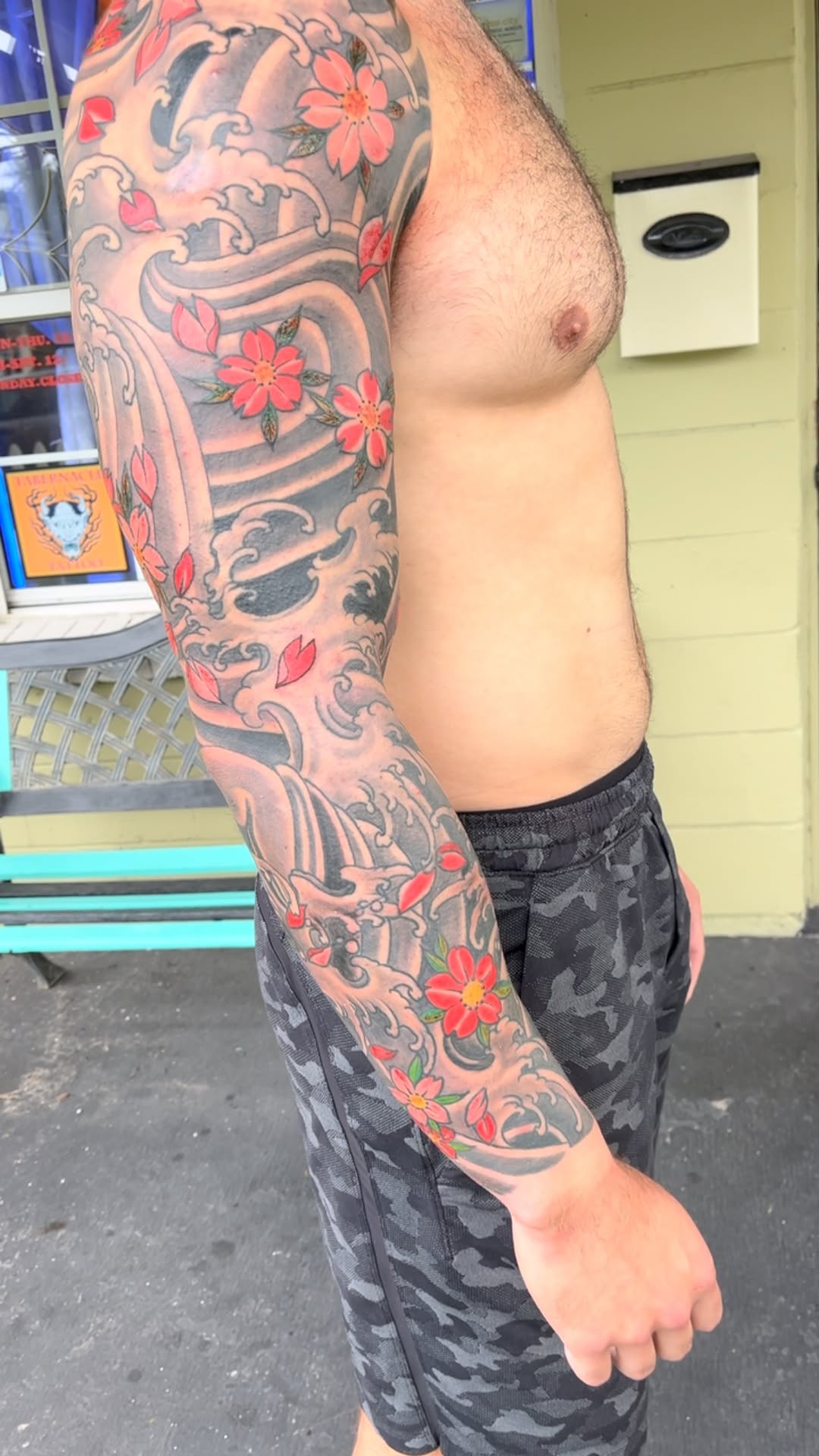 Vibrant Japanese cherry blossoms amid swirling waves sleeve