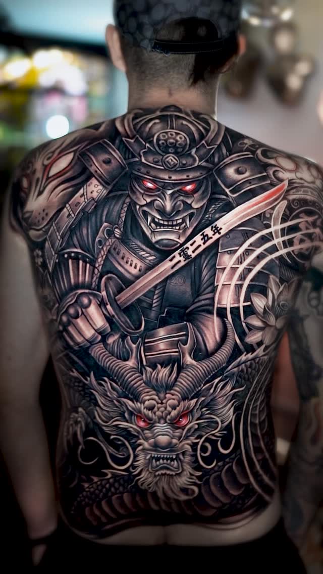 Intense grayscale Japanese back piece with armored samurai and dragon