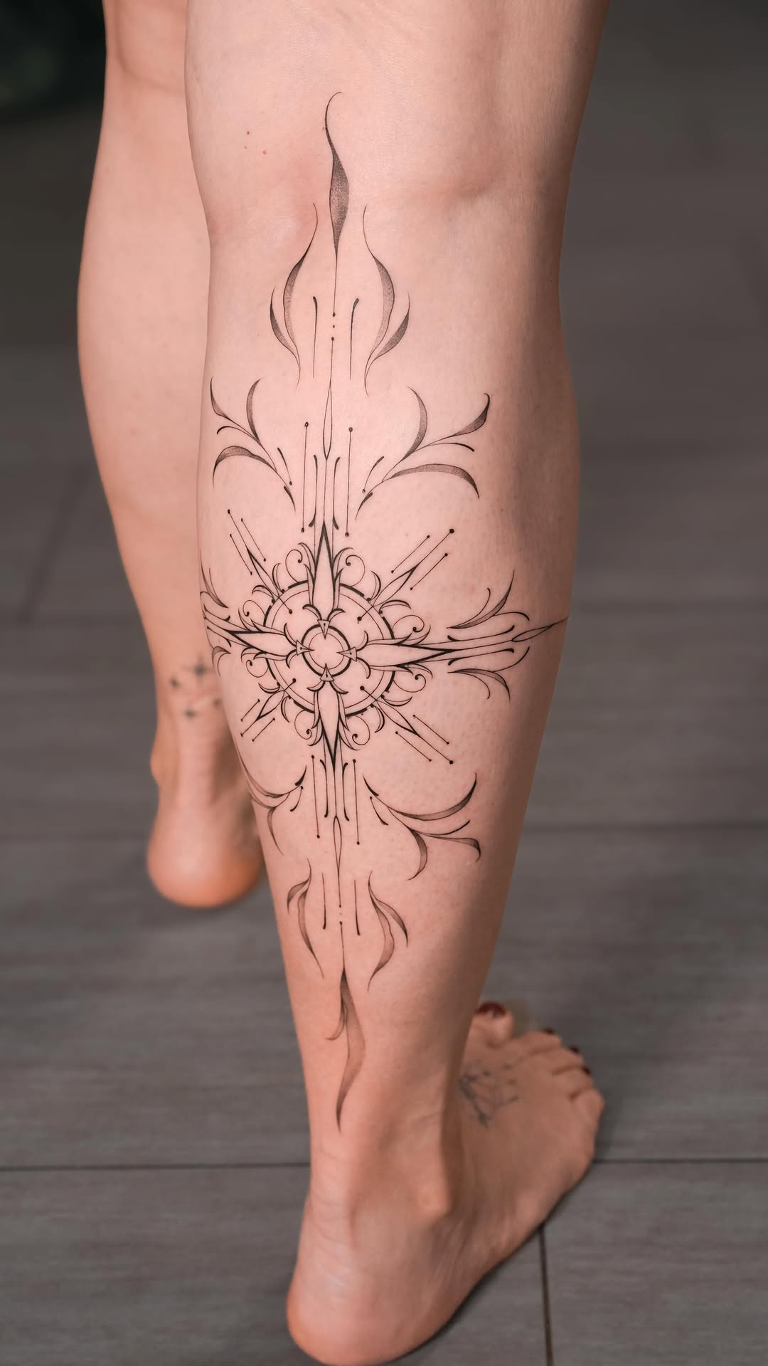 Intricate ornamental cross with delicate floral filigree