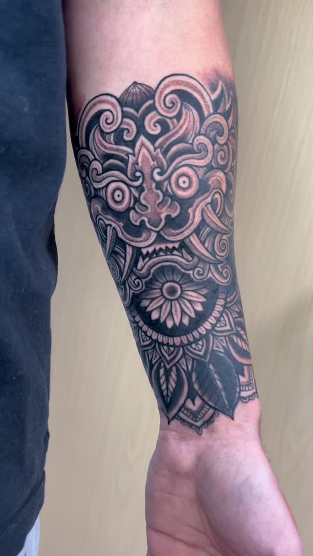 Intricate blackwork forearm sleeve with mandala florals