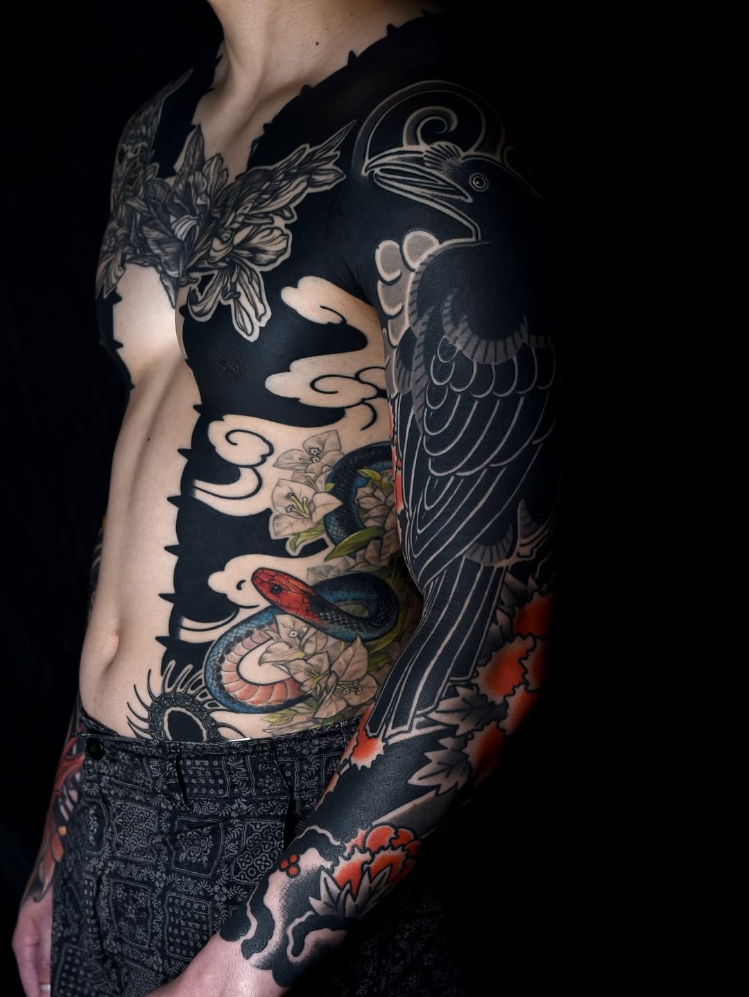 Japanese-inspired full sleeve with bold blackwork crane and snake