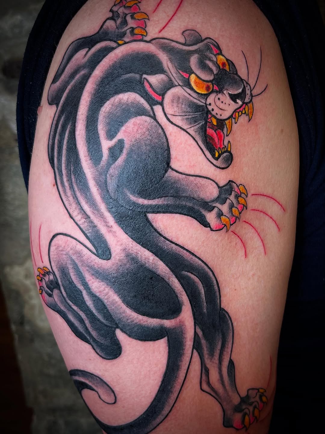 Aggressive cartoon demon-dog with bold black shading and orange accents