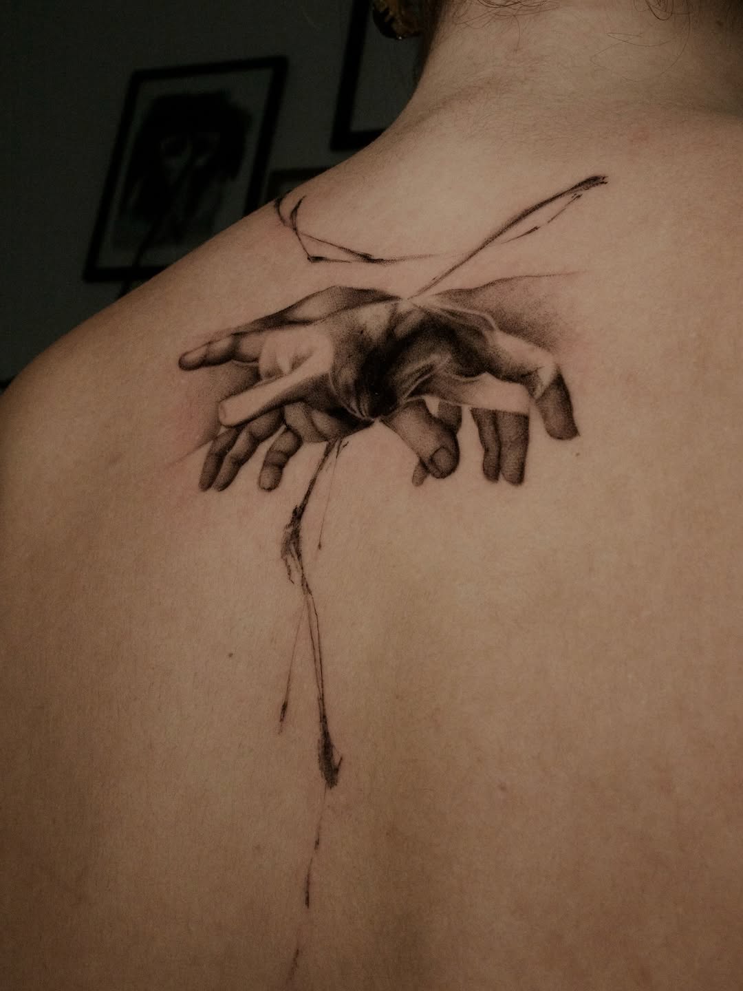 Hyper-realistic grayscale hands interwoven with delicate shading.