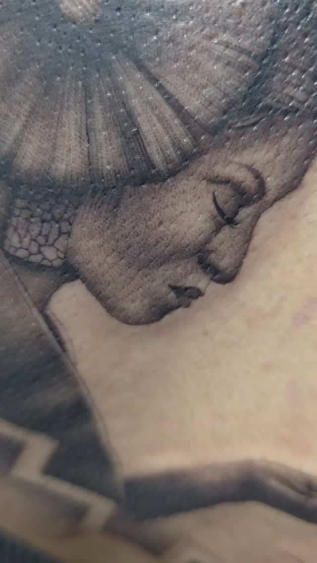 Soft grayscale realism portrait of a serene female profile