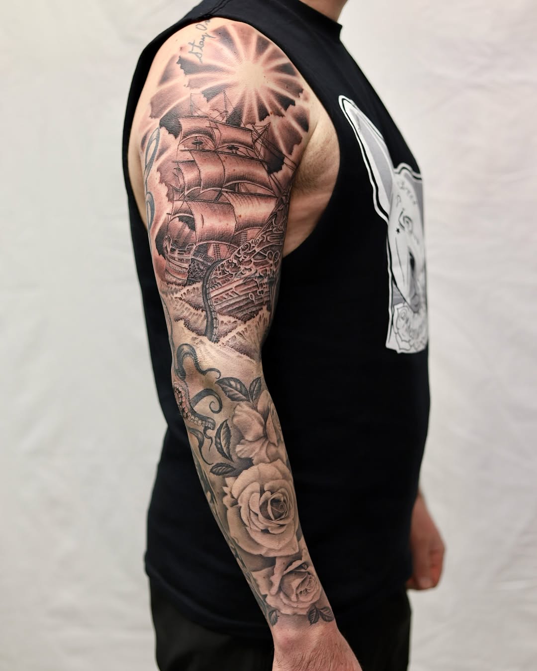 Intricate black-and-gray nautical sleeve with roses