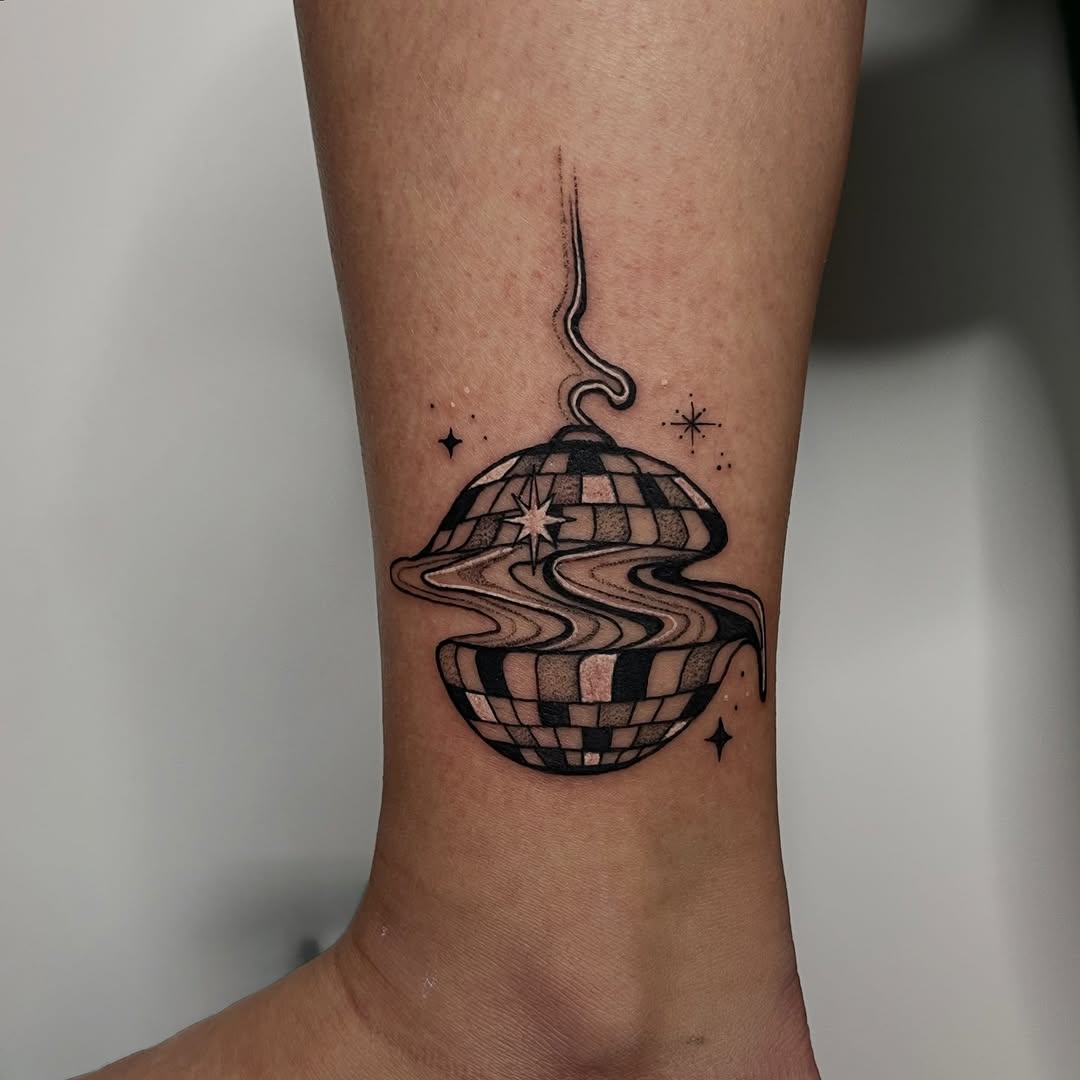 Small disco ball with warped checker pattern and swirls