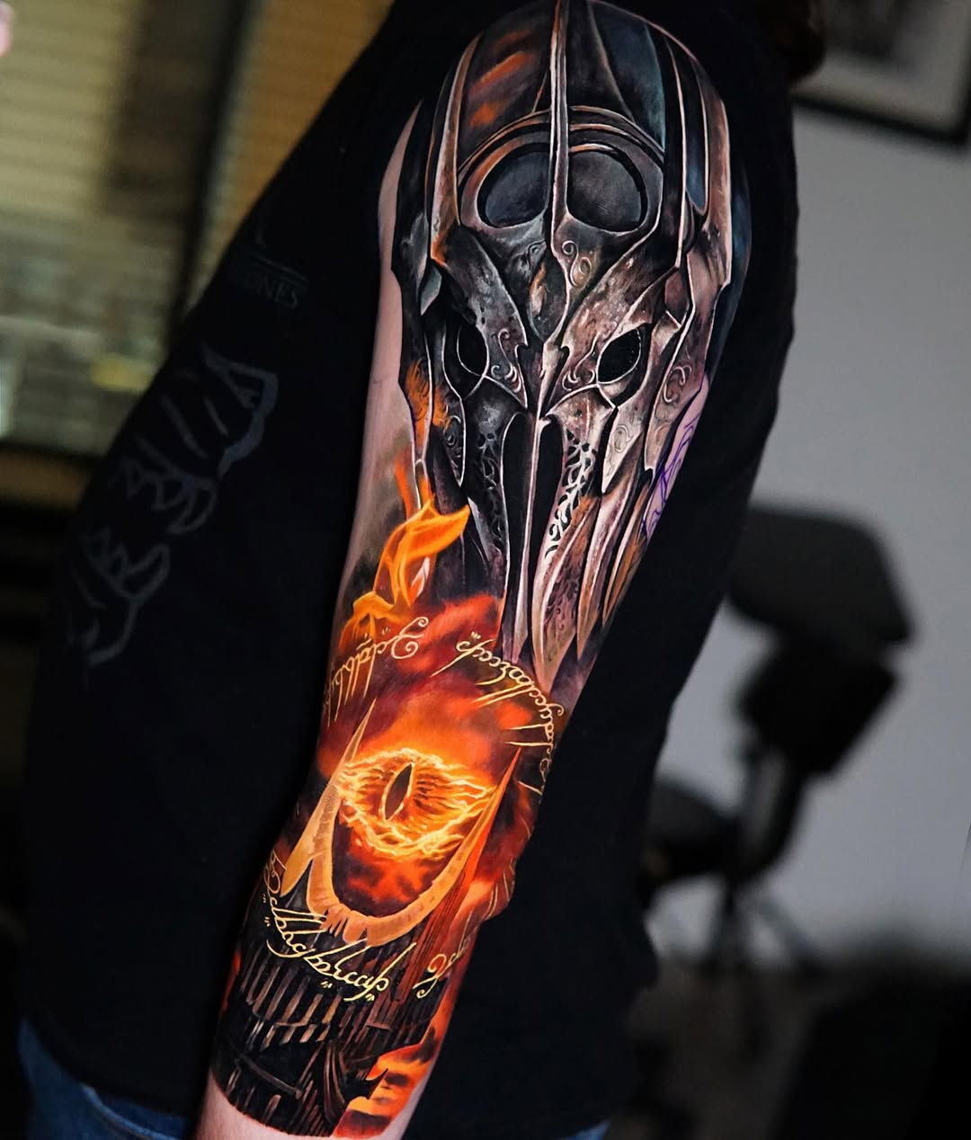 Intricate fantasy helmet tattoo with fiery orange accents