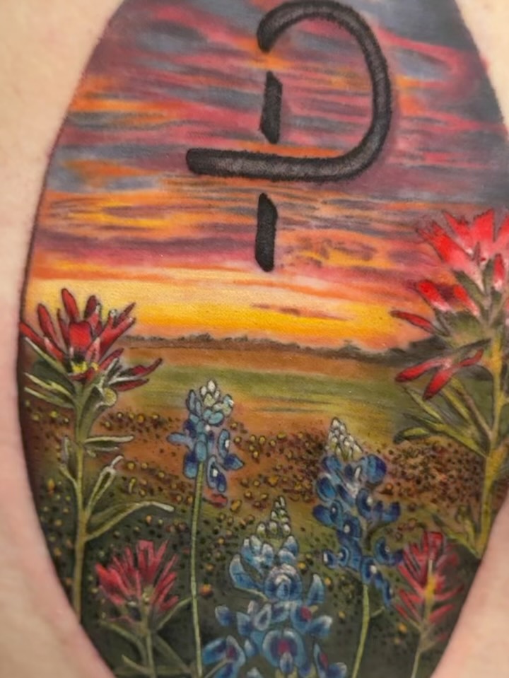 Vibrant Texas ranch landscape with sunset hues and wildflowers.