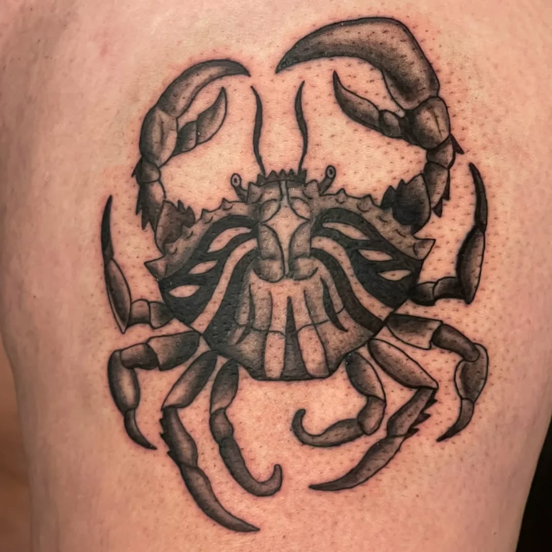 Bold blackwork crab with rugged, flowing linework.