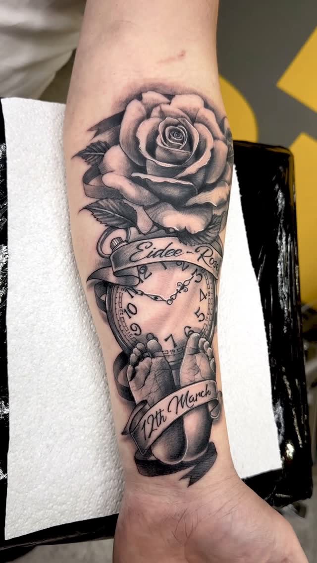 Monochrome rose with vintage pocket watch, elegant ribbon.