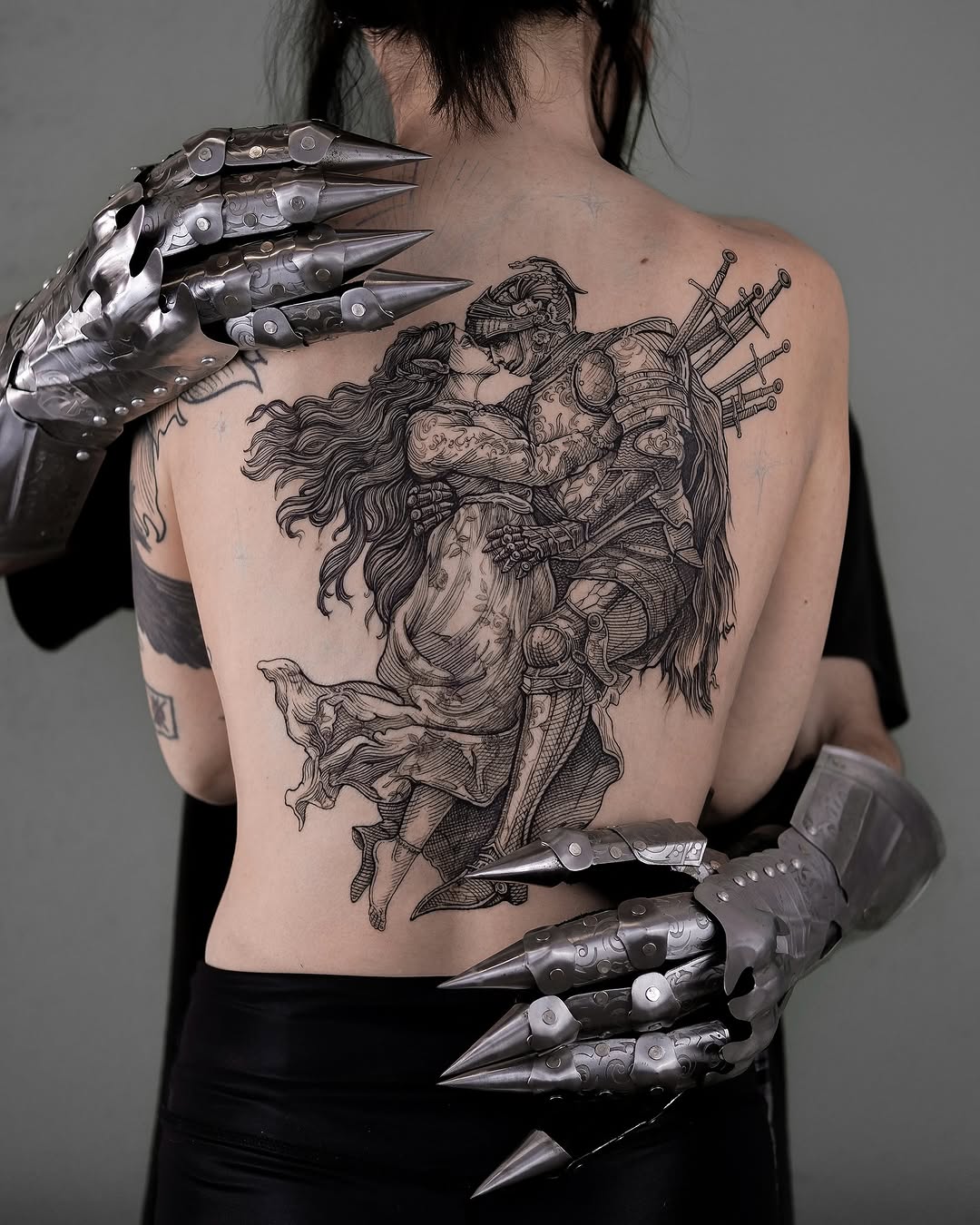 Ornate medieval engraving of knight and lover embracing