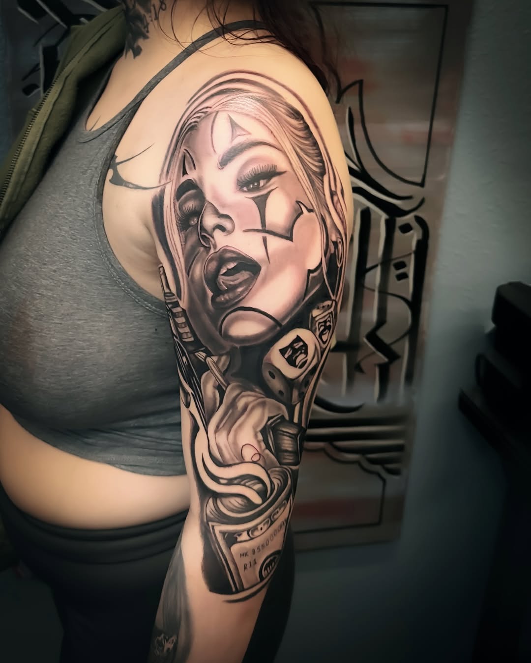 Striking black-and-gray realism sleeve with stylized female portrait