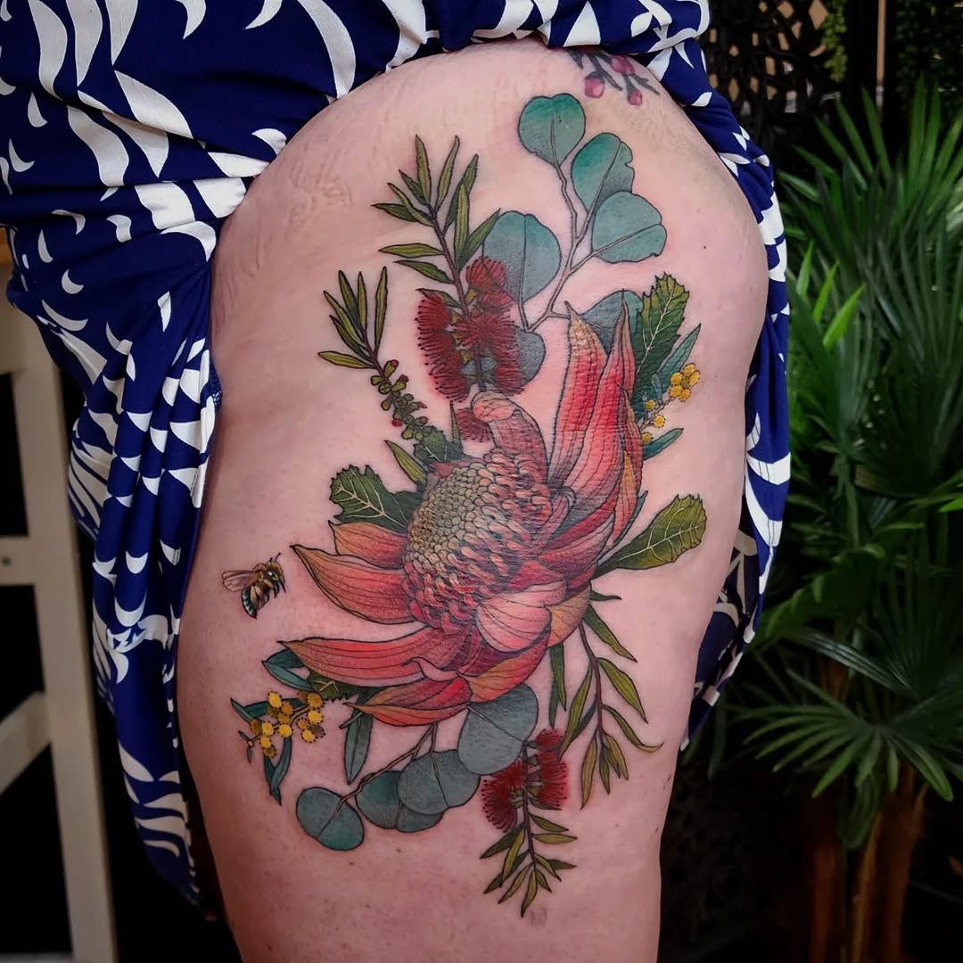 Vibrant protea bouquet with eucalyptus leaves and bee