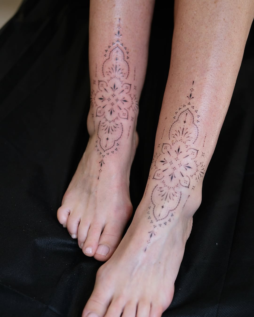Matching fineline ankle tattoos