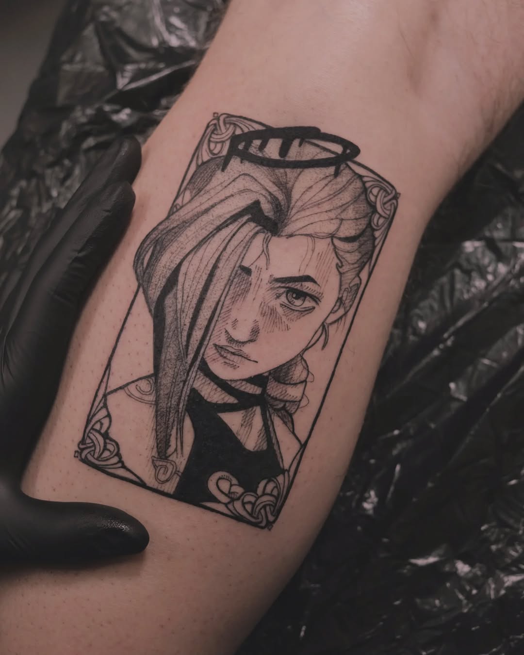 Delicate fine-line portrait within an ornate frame.