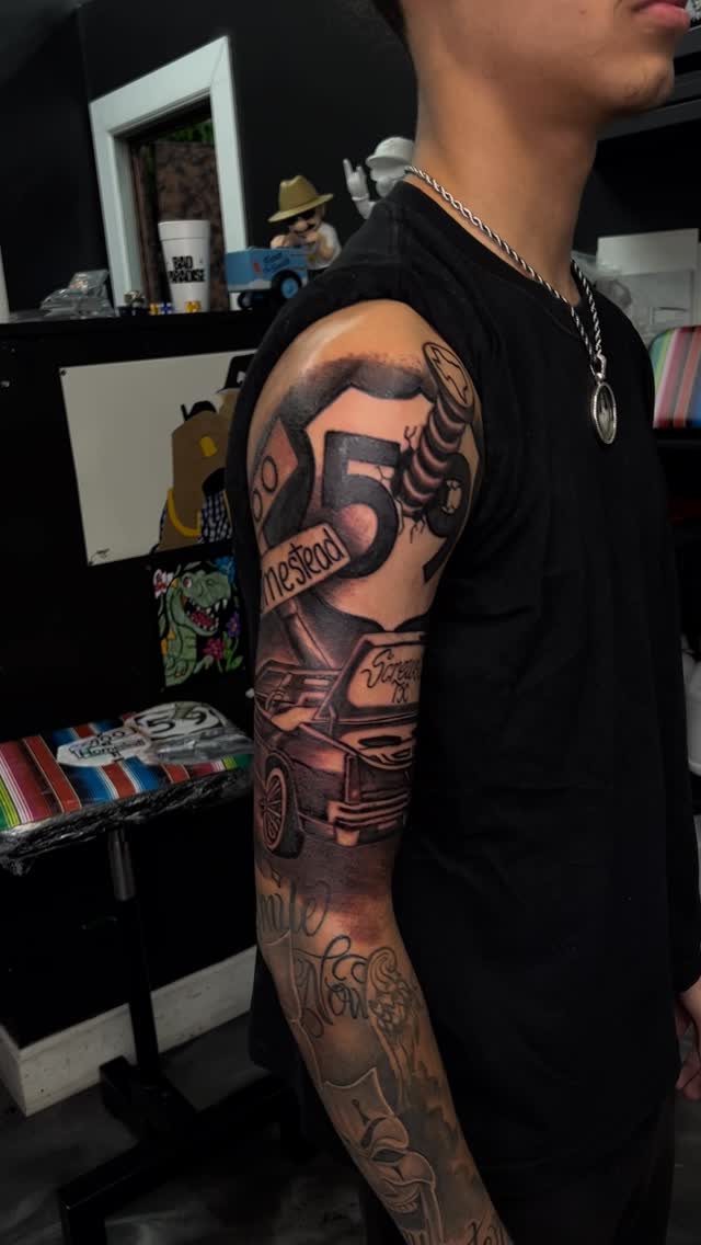 Bold black-and-gray sleeve with large 5 and machinery imagery